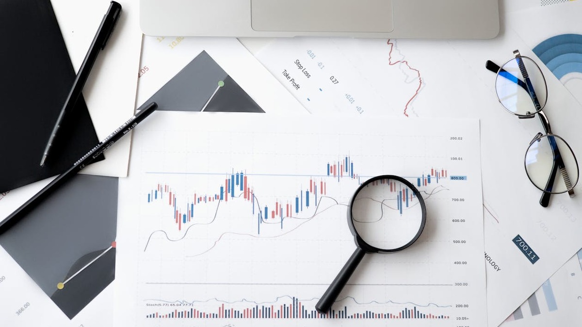 A magnifying glass on a document, symbolizing careful fact verification of AI-generated content