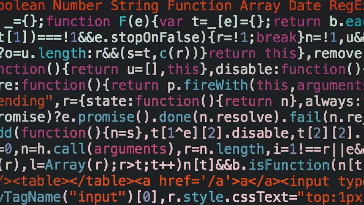 Code displayed on a monitor screen in a dark developer setup