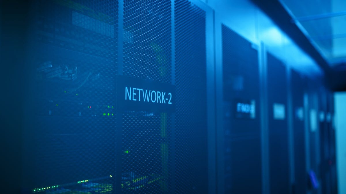 Server rack room with rows of illuminated network equipment