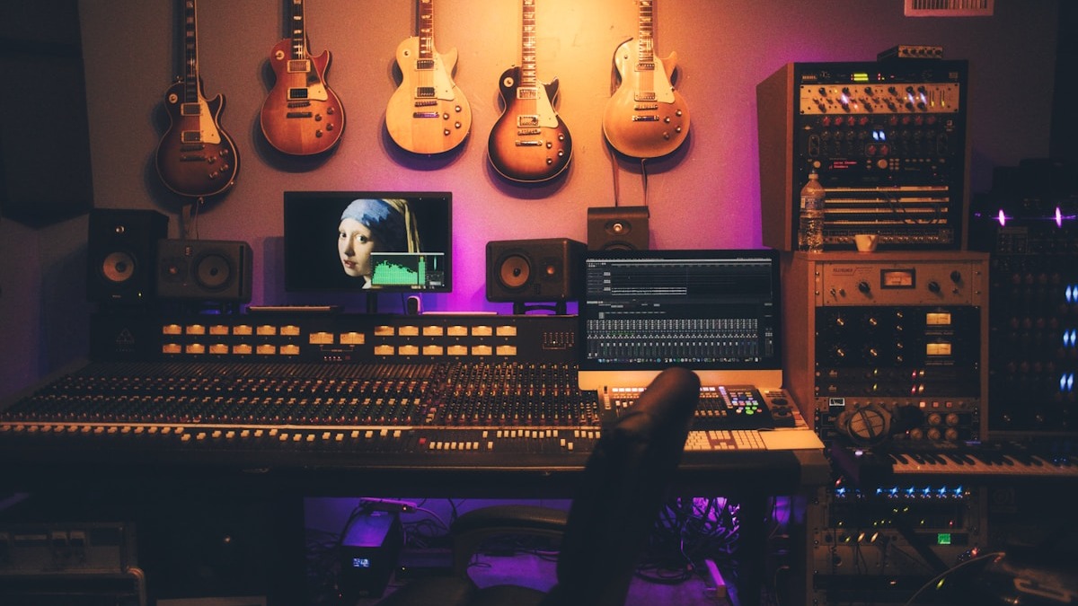 Professional audio studio recording setup with mixing console