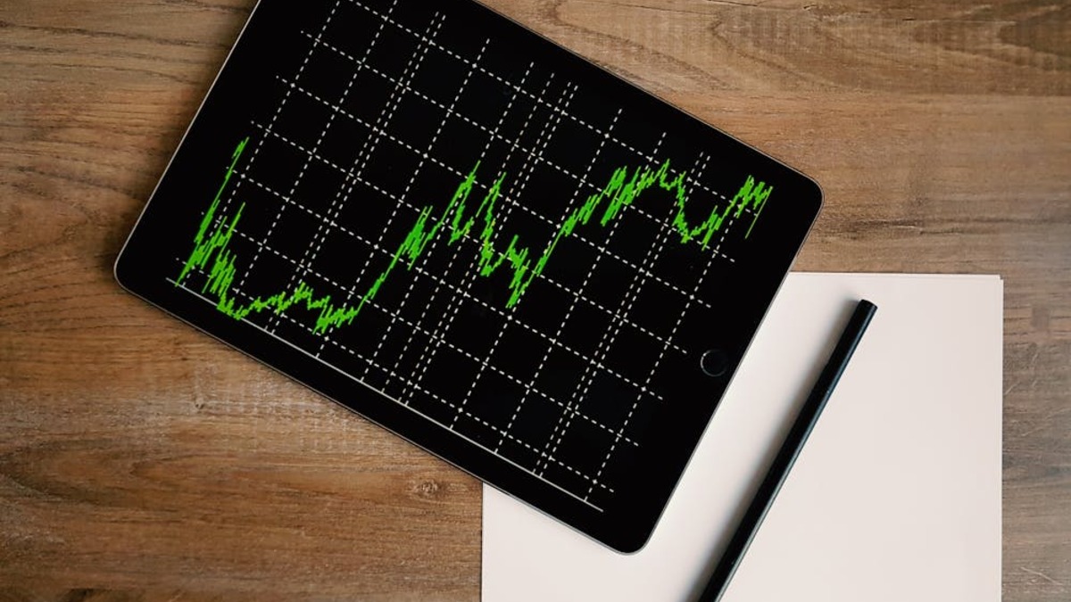 Stock market trading screens showing financial data and indices