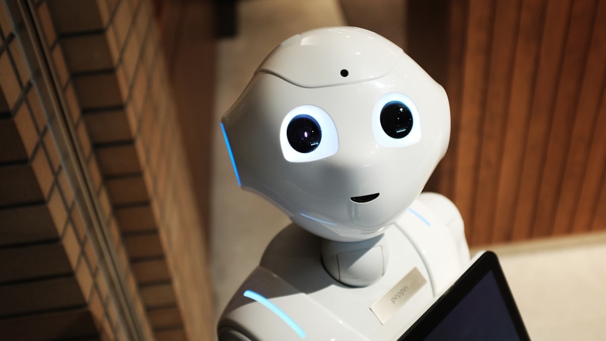 A humanoid robot in a research lab setting represents the frontier of physical AI