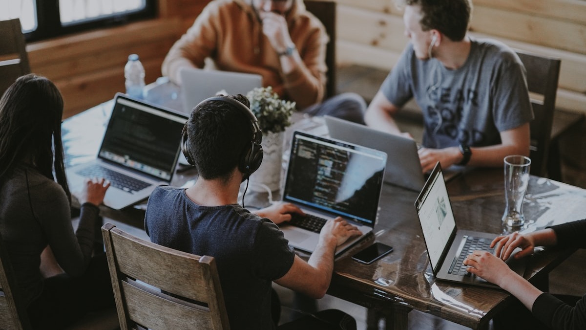 Tech workers collaborating in a modern office
