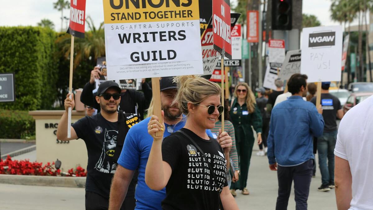 SAG-AFTRA and WGA strike picket line with protest signs