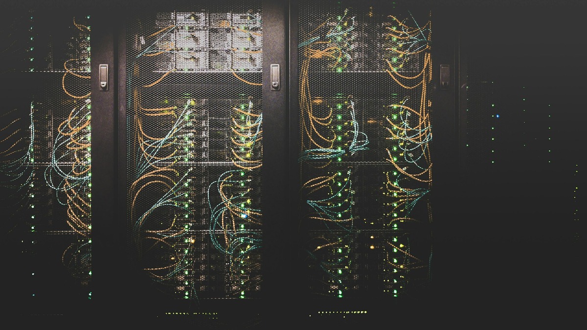 Modern data center server rack rows with blue lighting