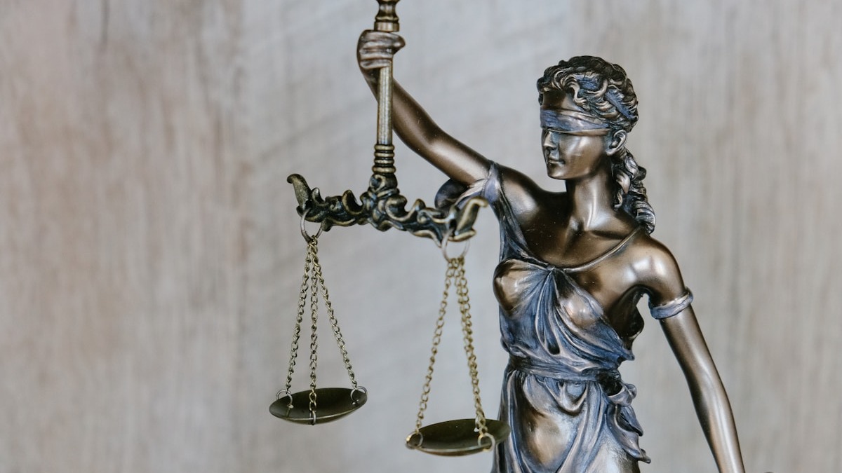 Scales of justice representing the balance of safety claims between xAI and OpenAI