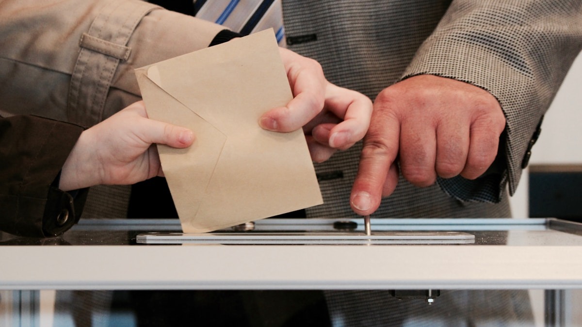 A ballot being cast into a voting box - the 2026 midterms have become a proxy war for AI regulation