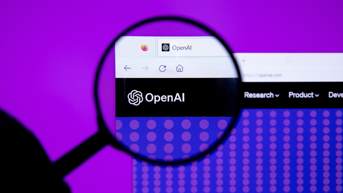 OpenAI logo under a magnifying glass
