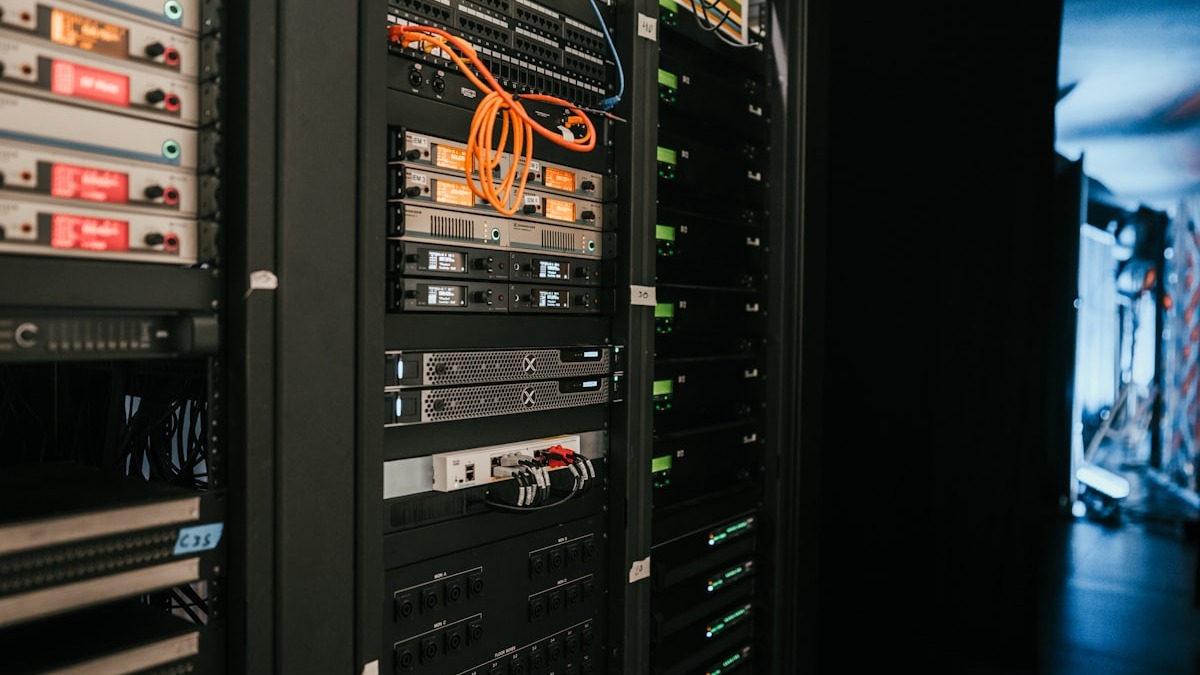 Rows of server racks inside a modern data center