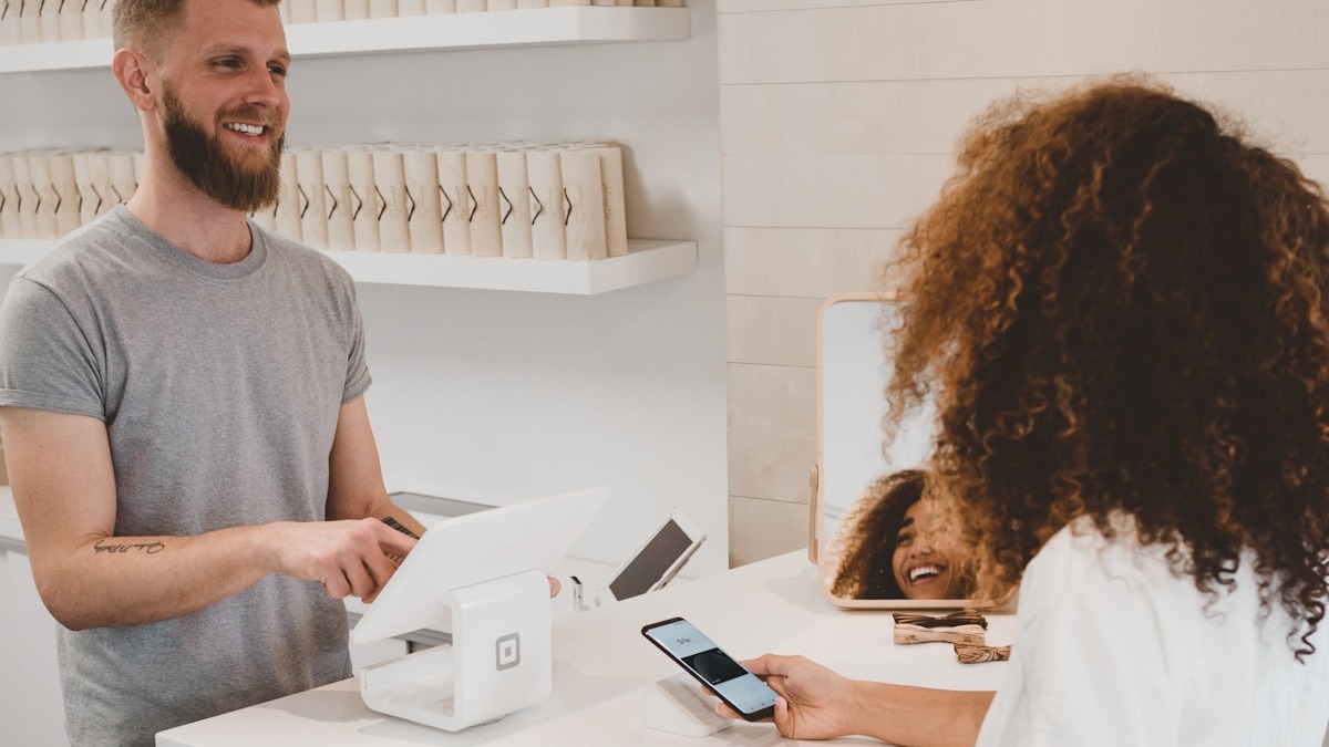 A merchant completing a transaction at a Shopify POS terminal