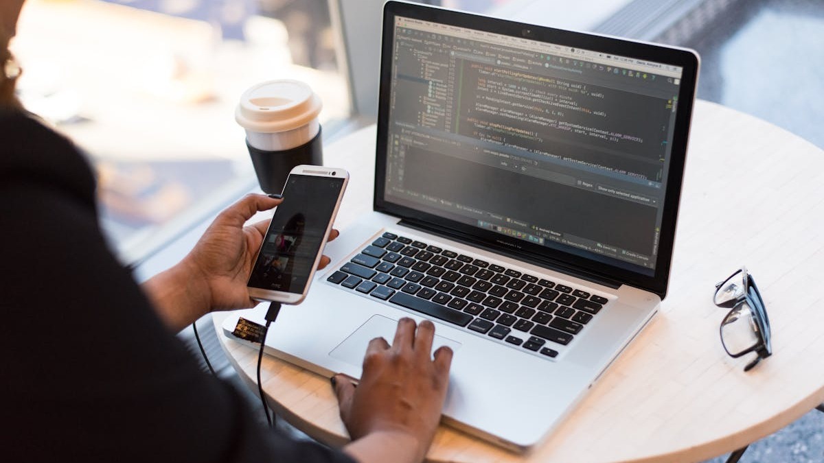 Laptop screen showing code in a developer environment with dark theme