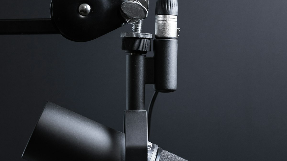 A professional condenser microphone in a recording studio, representing Grok 4.3's new voice cloning and Custom Voices feature